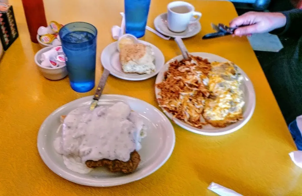 Country Fried Steak with Cheese over Half Order of Biscuits & Gravy